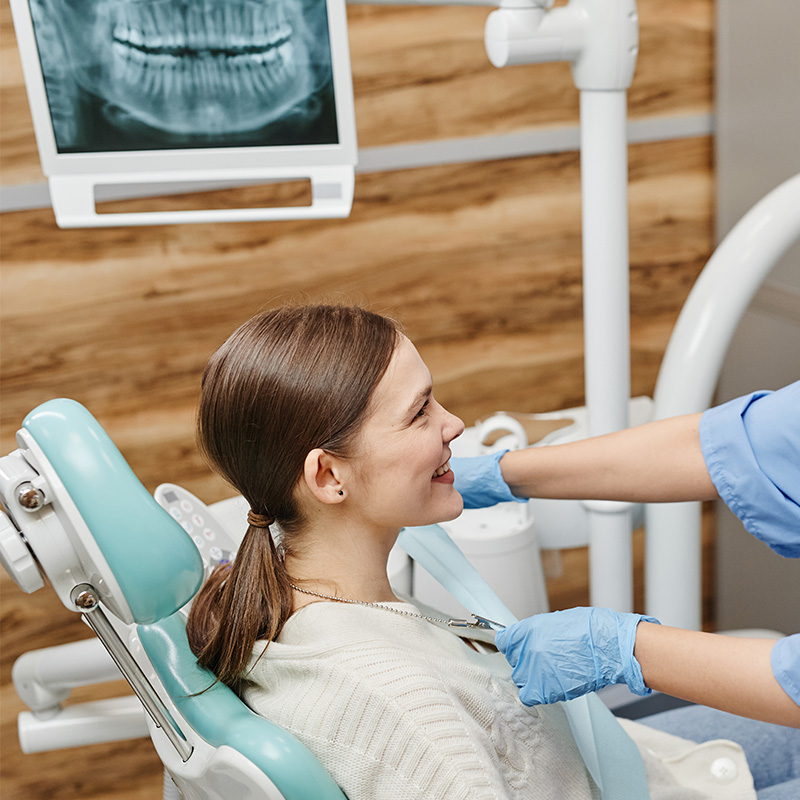 Woman in Dentists Chair at Dental Clinic